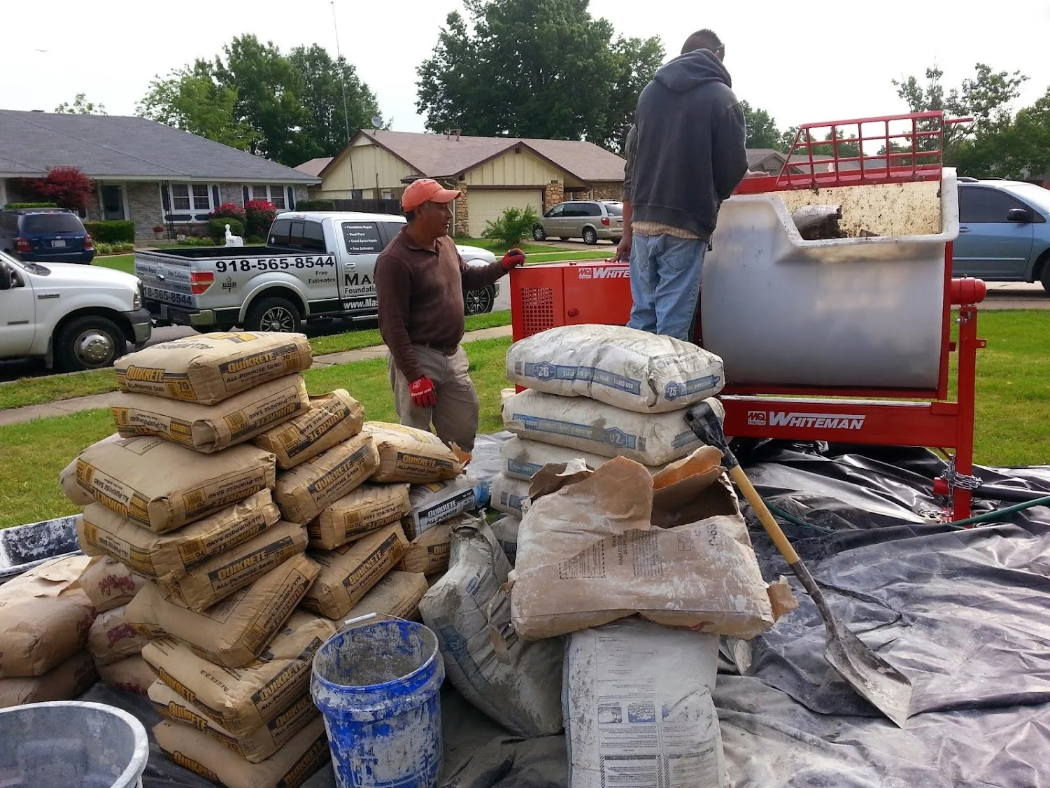 Foundation repair materials and equipment staged at residential property in Tulsa